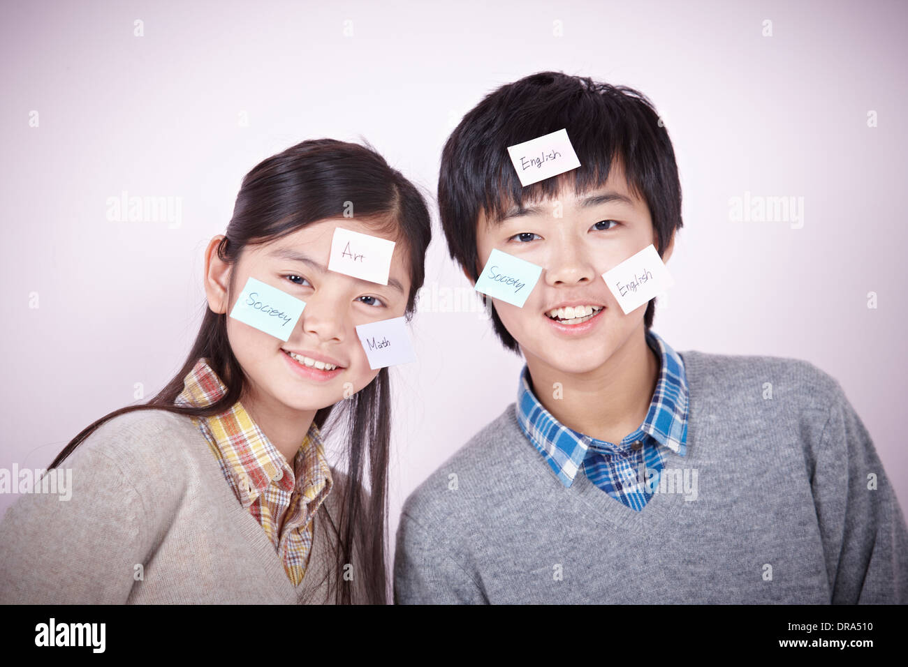 kids with post-it notes all over her head Stock Photo