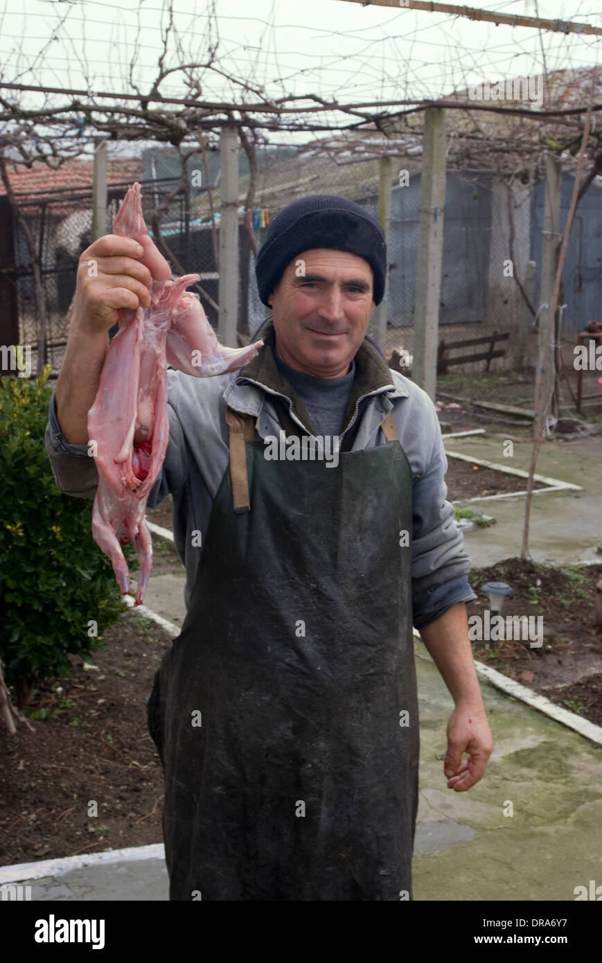 Malomirovo village mayor with his freshly skinned rabbit for an evening ...
