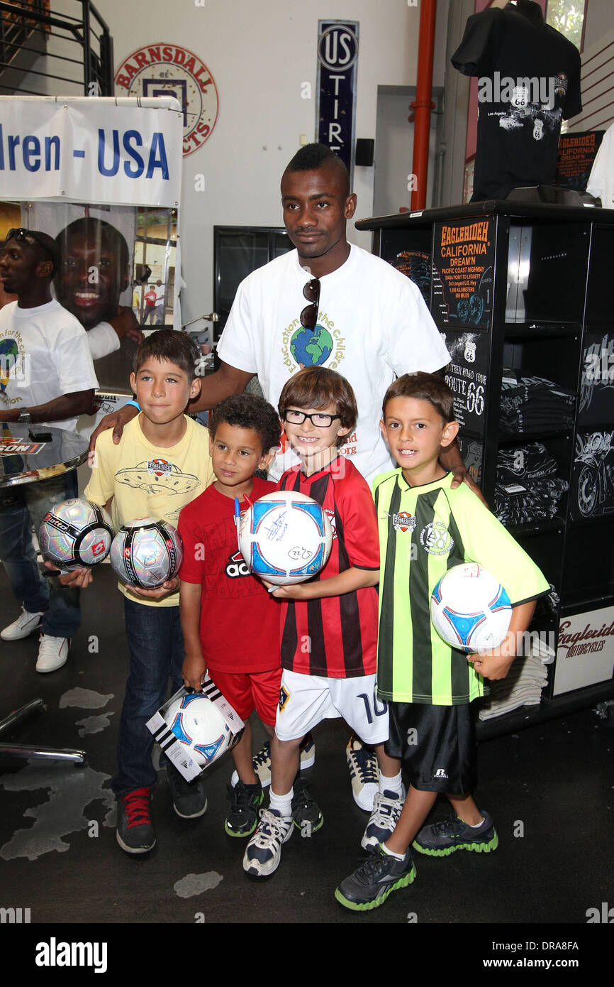 Solomon Kalou Professional football players from the English Premier League host an event at Eaglerider Motorcycles in support of 'armsaroundthechild.org' Los Angeles, California - 01.07.12 Stock Photo