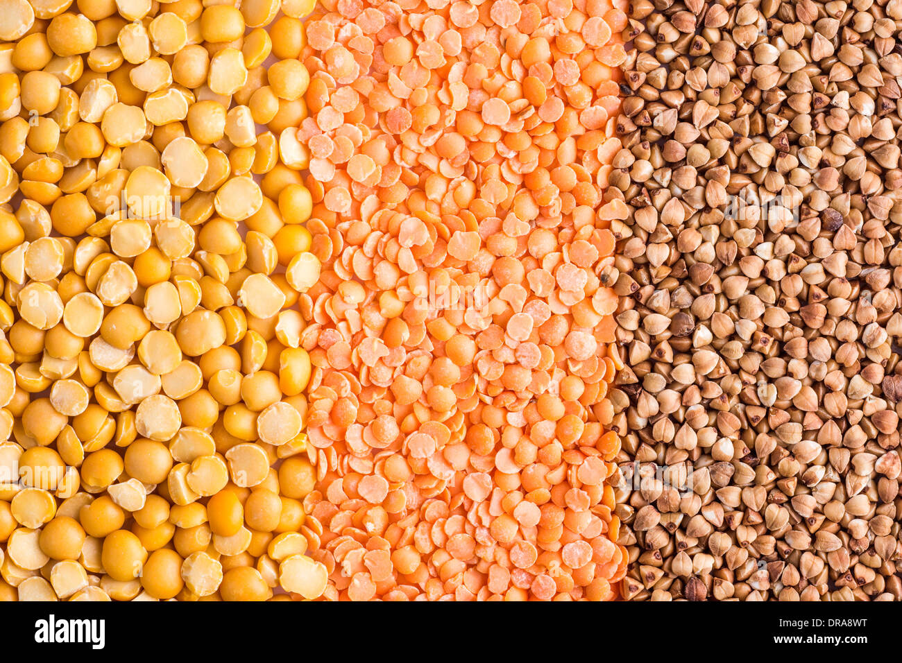 Shredded peas, lentils and buckwheat background Stock Photo
