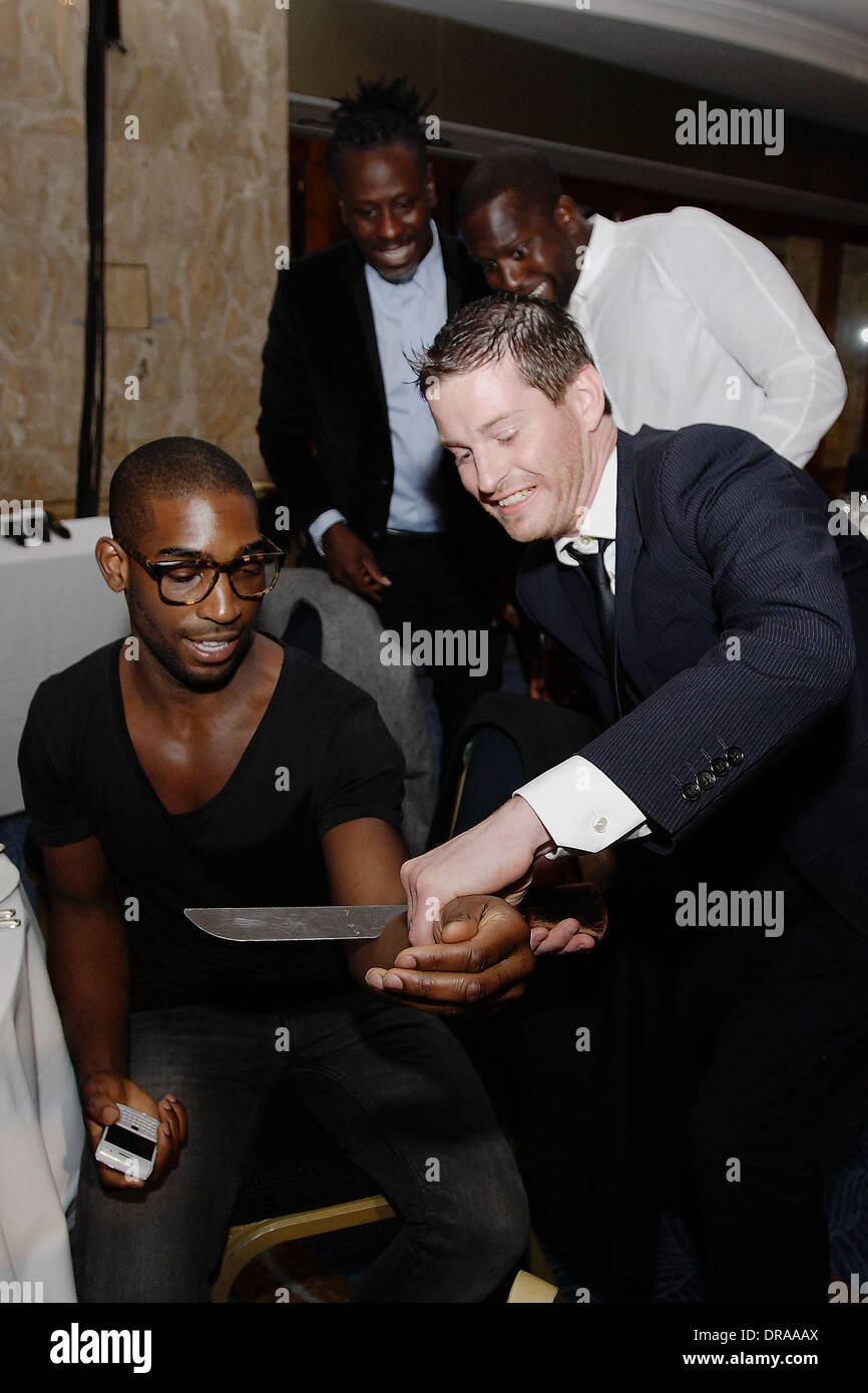 Tinie Tempah shares a magic trick with magician Paul Lytton, The Nordoff  Robbins O2 Silver Clef Awards held at the Hilton Park Lane. London, England  - 29.06.12 Stock Photo - Alamy