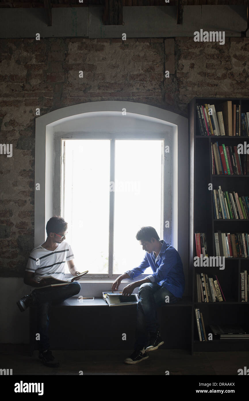 two men in library Stock Photo