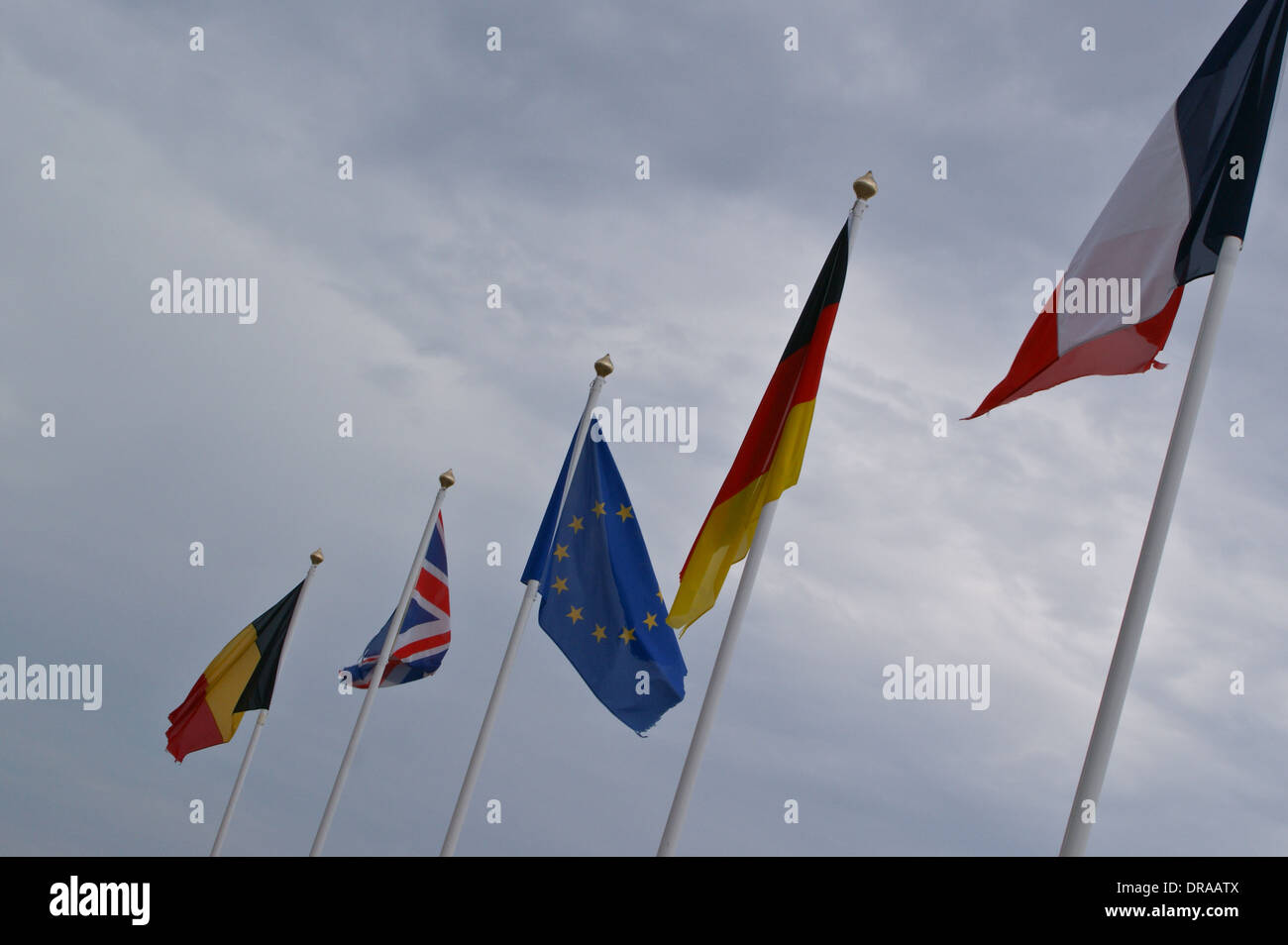 National flags of France, Netherlands, Belgium, EU and Union Flag on flagpoles, Wimereux, Côte Opale, Nord-Pas-de-Calais, France Stock Photo