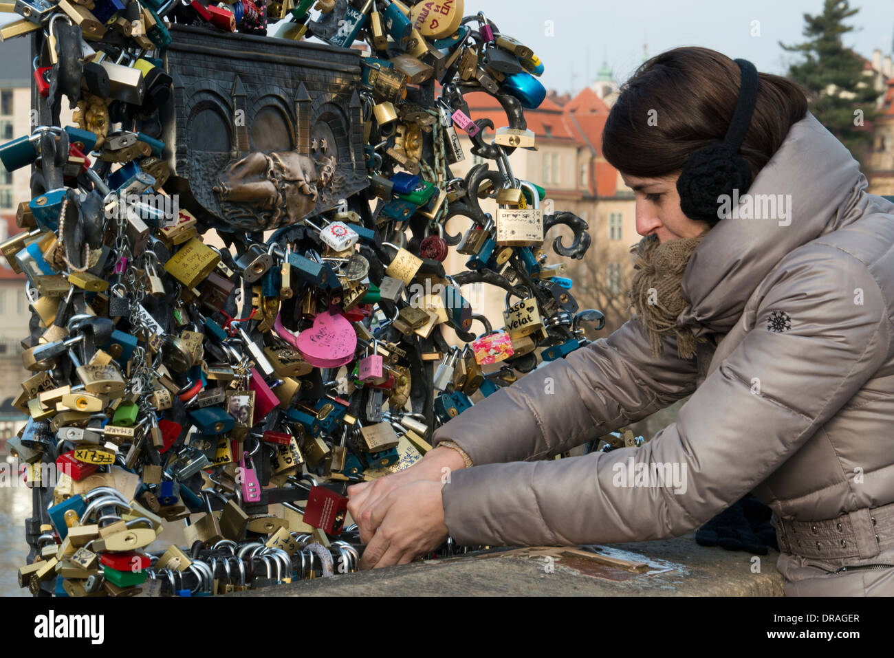 The couples swear eternal love by placing a lock on the Charles Bridge
