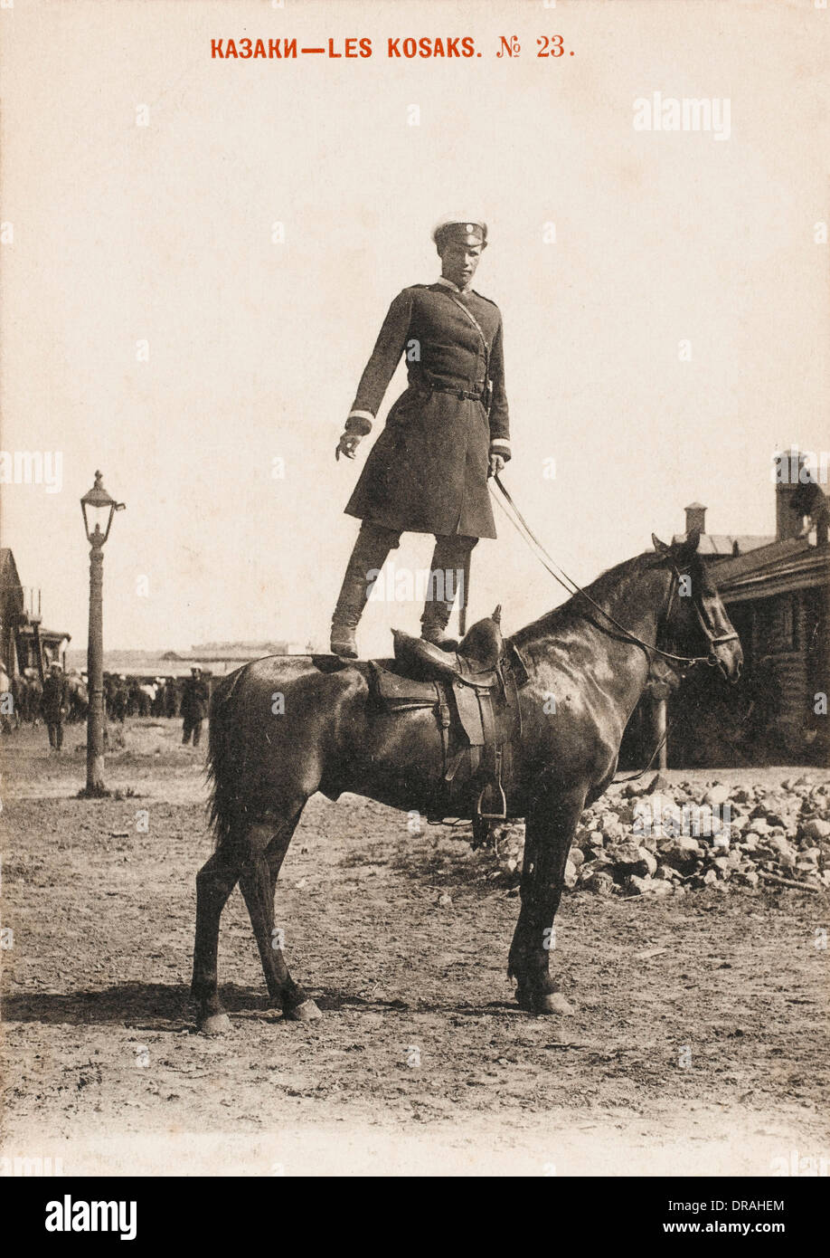 Cossack standing on horse's back Stock Photo