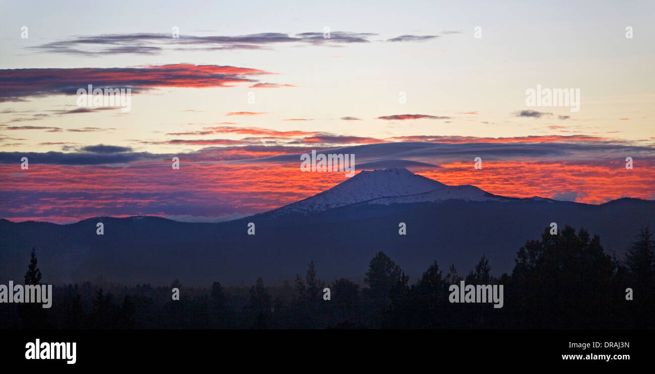 A winter sunset on Mount Bachelor, Oregon Cascades, with lenticular clouds Stock Photo