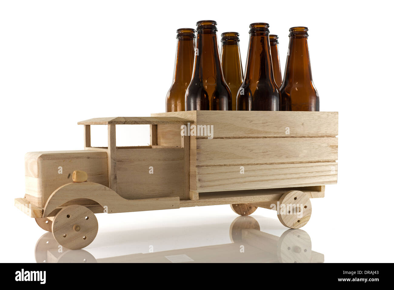 wooden car with beer bottles isoalted on white Stock Photo