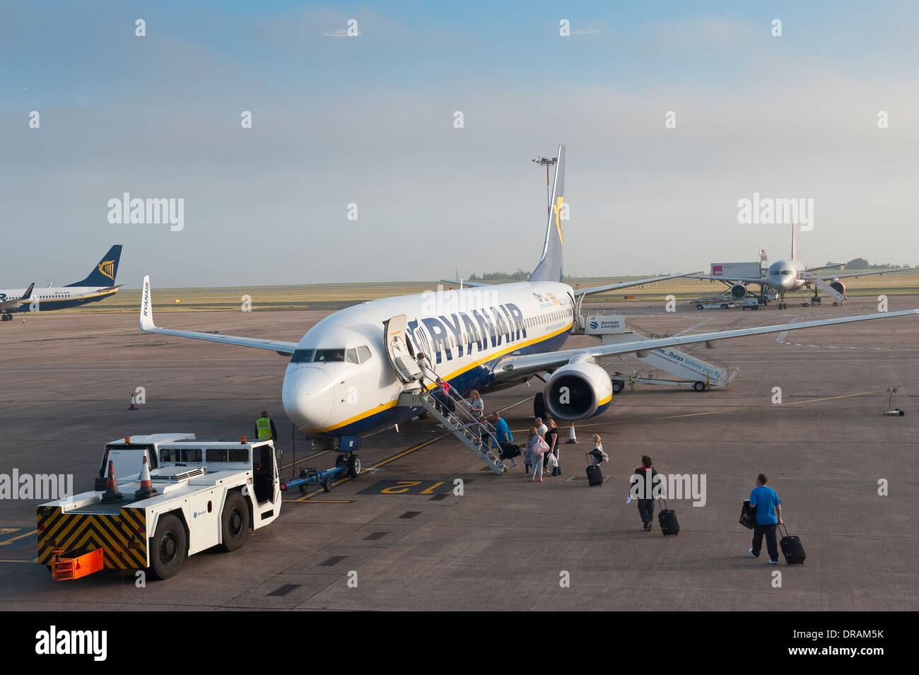 Passengers boarding a Ryanair plane at an airport. Stock Photo