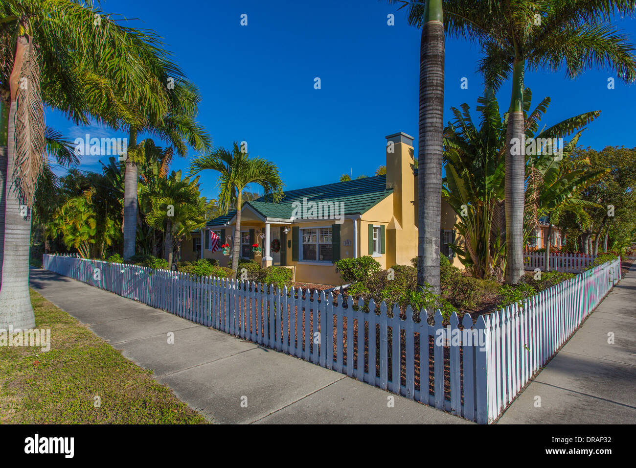 American Craftsman bungalow house among tropical palm trees in Punta Gorda Florida Stock Photo