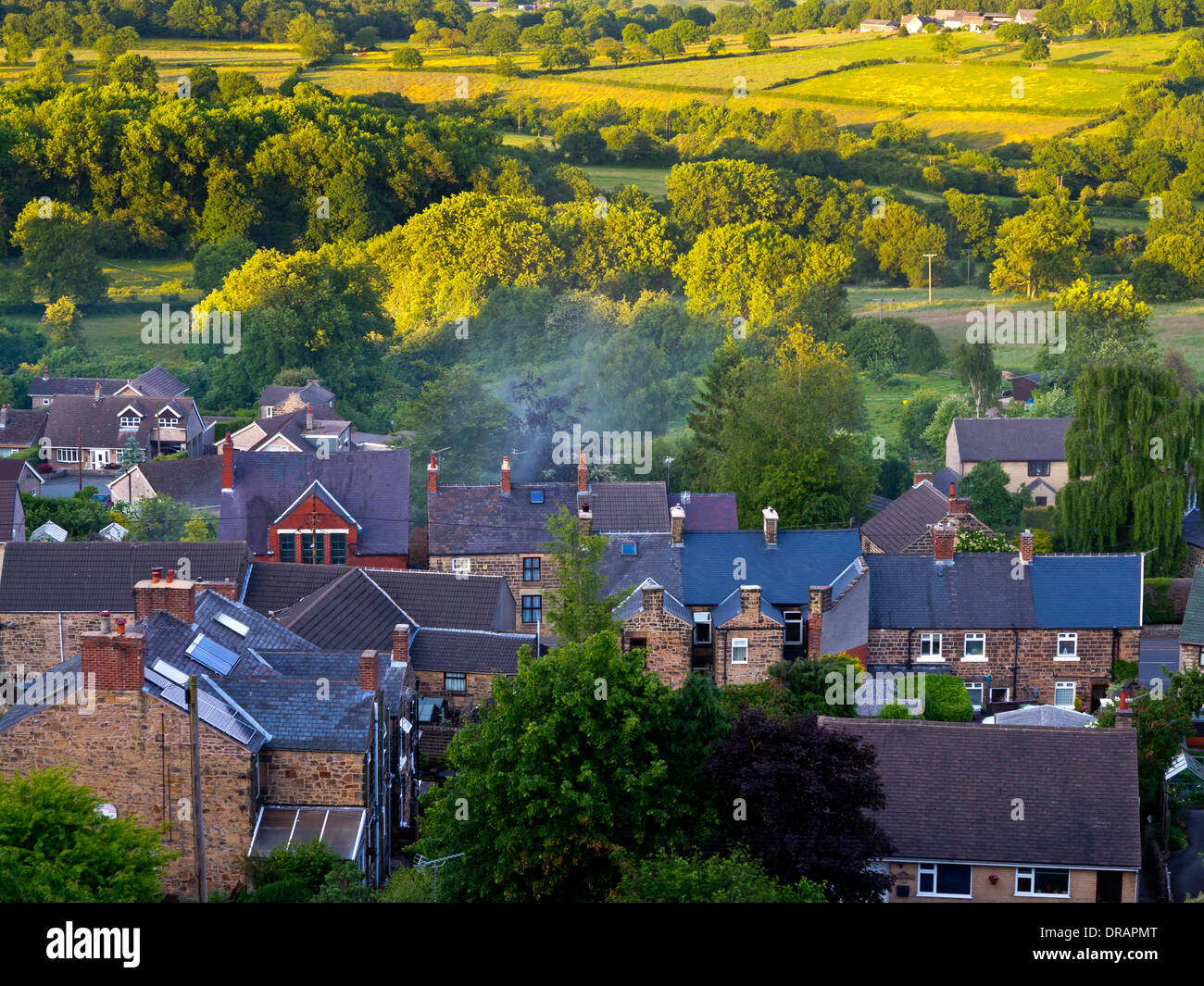 Rural housing with green belt countryside next to village houses in Crich Amber Valley Derbyshire Peak District England UK Stock Photo
