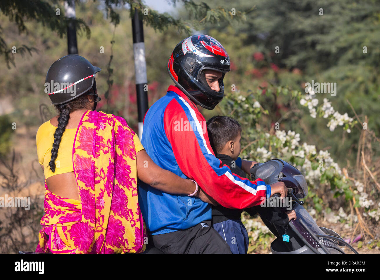 A family on a motorbike in Ahmedebad, India. Stock Photo
