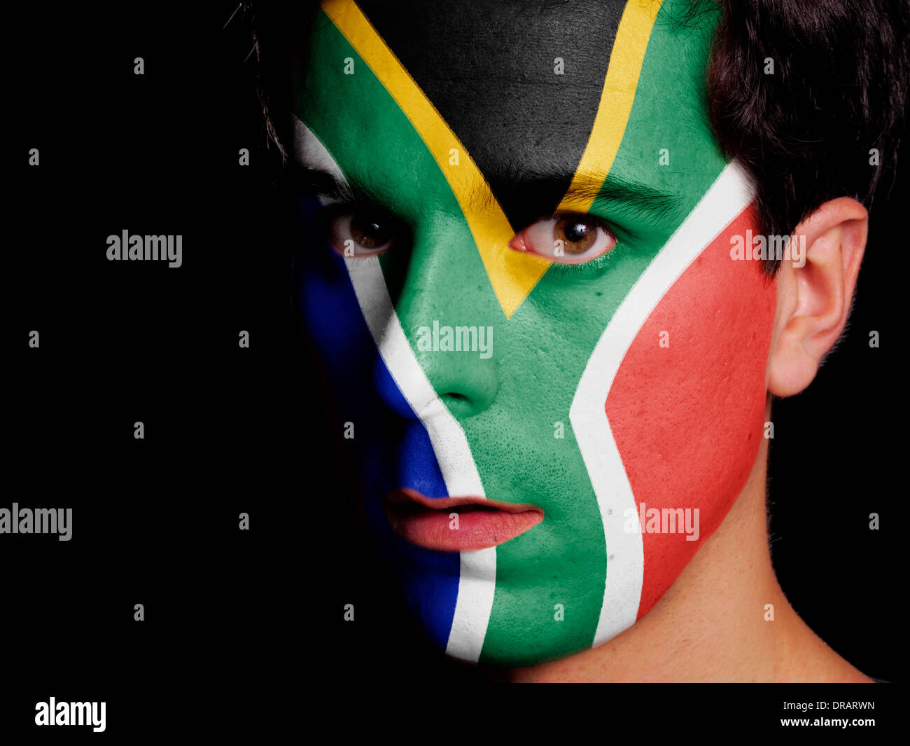 Flag of South Africa Painted on a Face of a Young Man Stock Photo