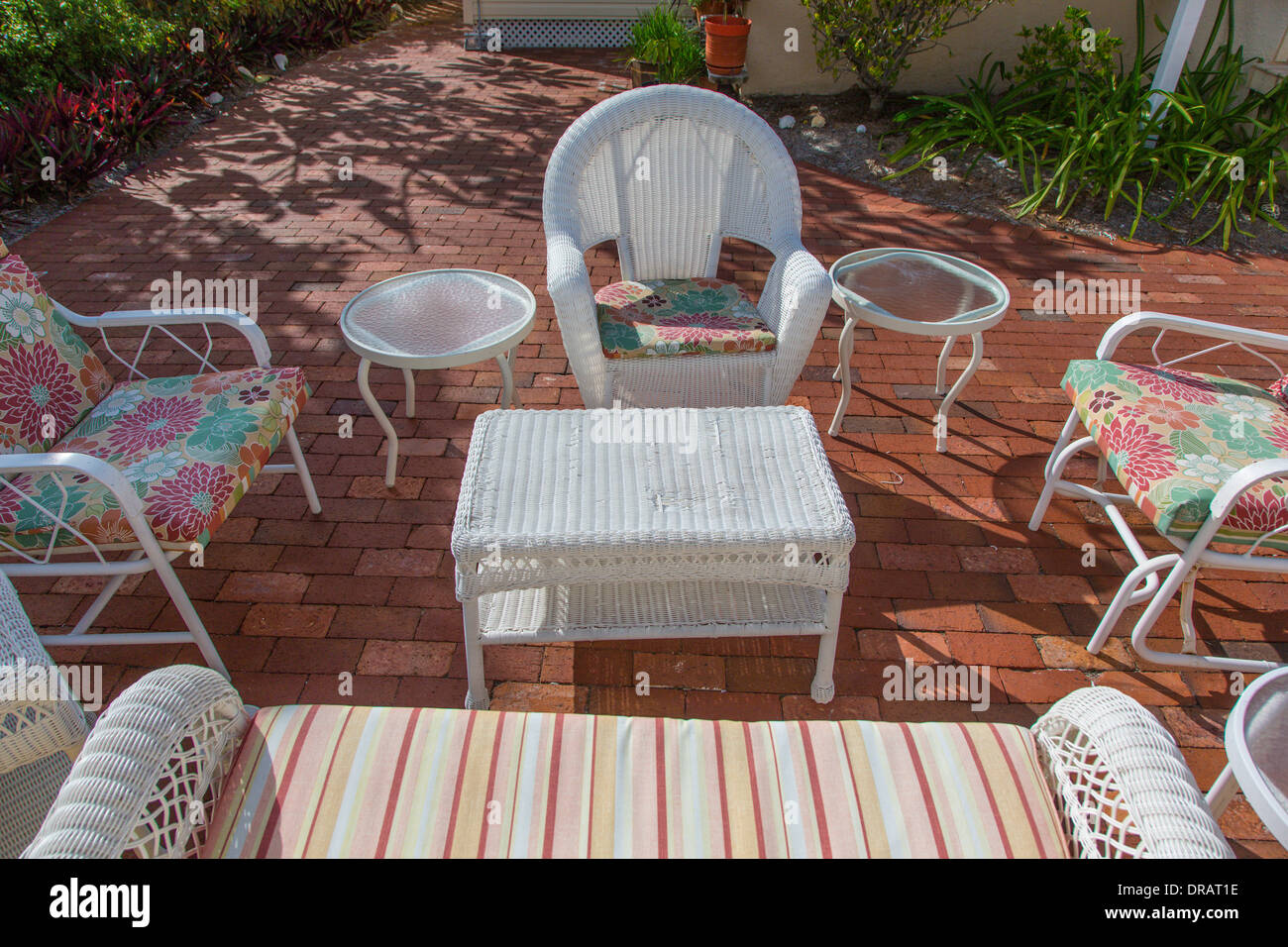 Outdoor Seating Area With White Wicker Furniture In Village Of