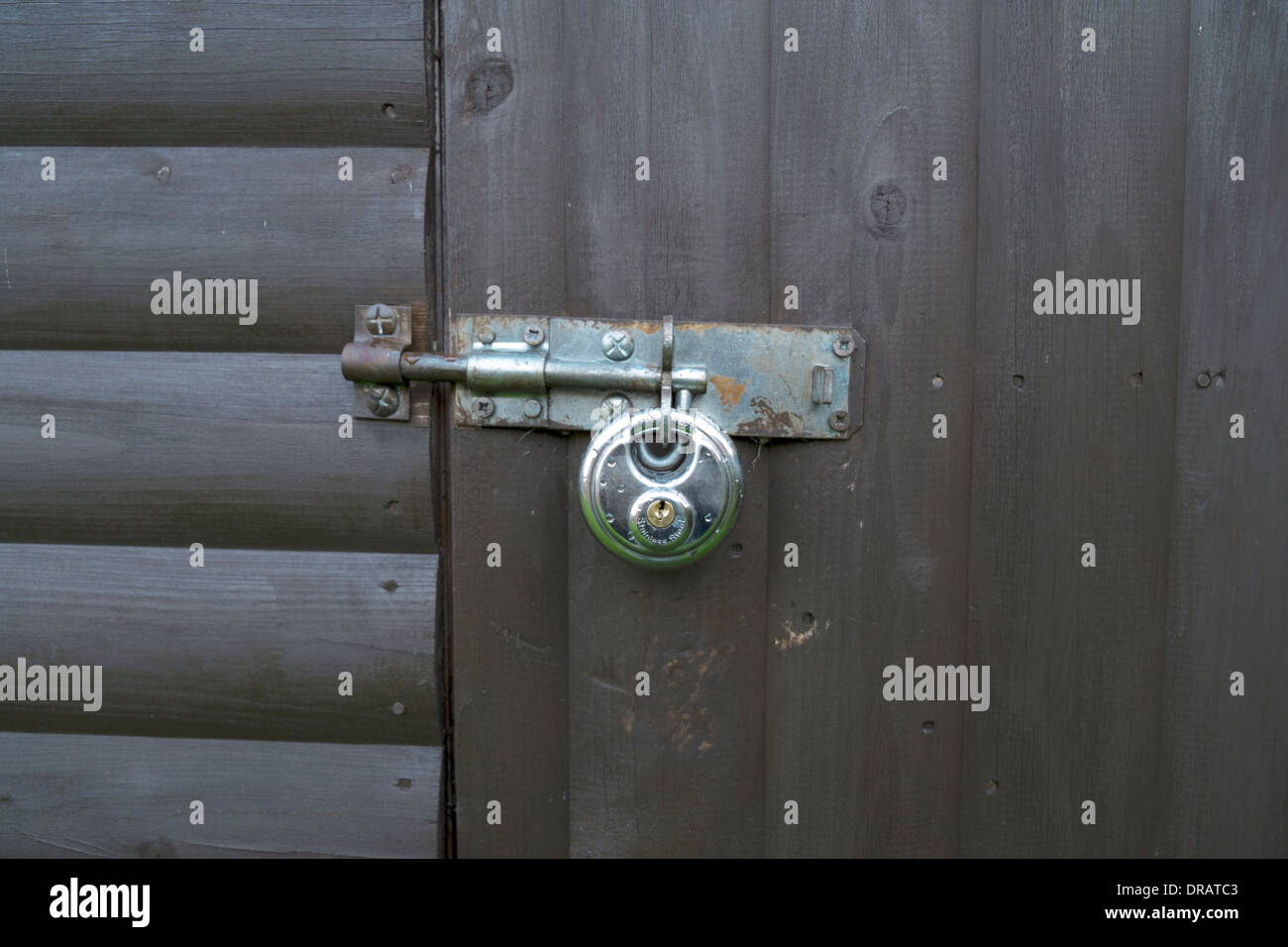 padlock on shed hasp bolt protection from burglars safety close detail