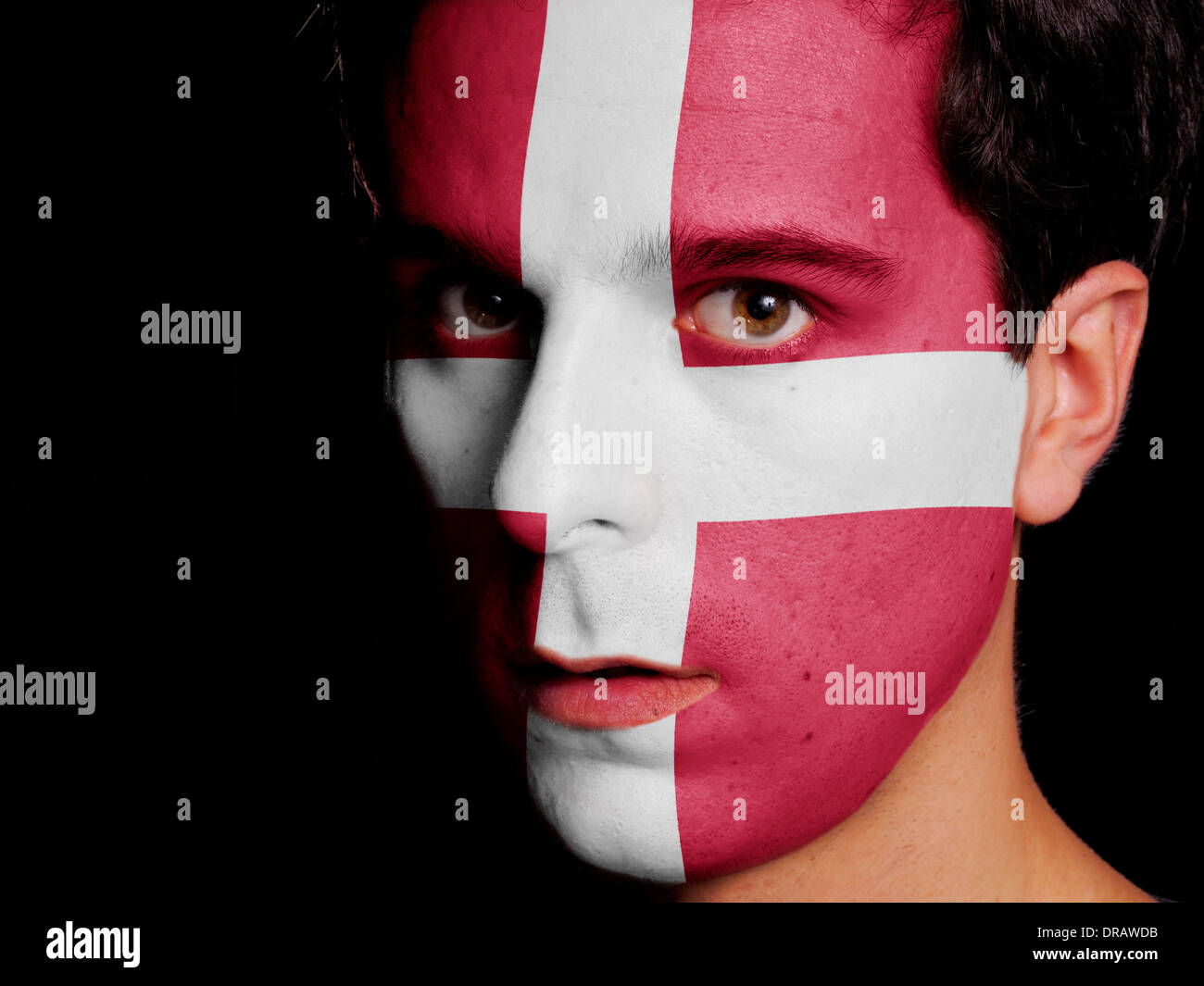 Flag of Denmark Painted on a Face of a Young Man Stock Photo