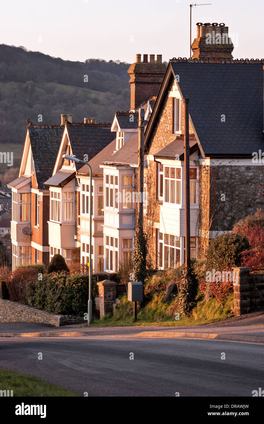 A row of side lit terraced houses on Church Hill, Honiton, Devon Stock Photo