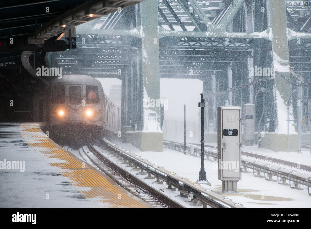 A subway train arrives at the Smith Street-9th Street station on the elevated portion of the IND