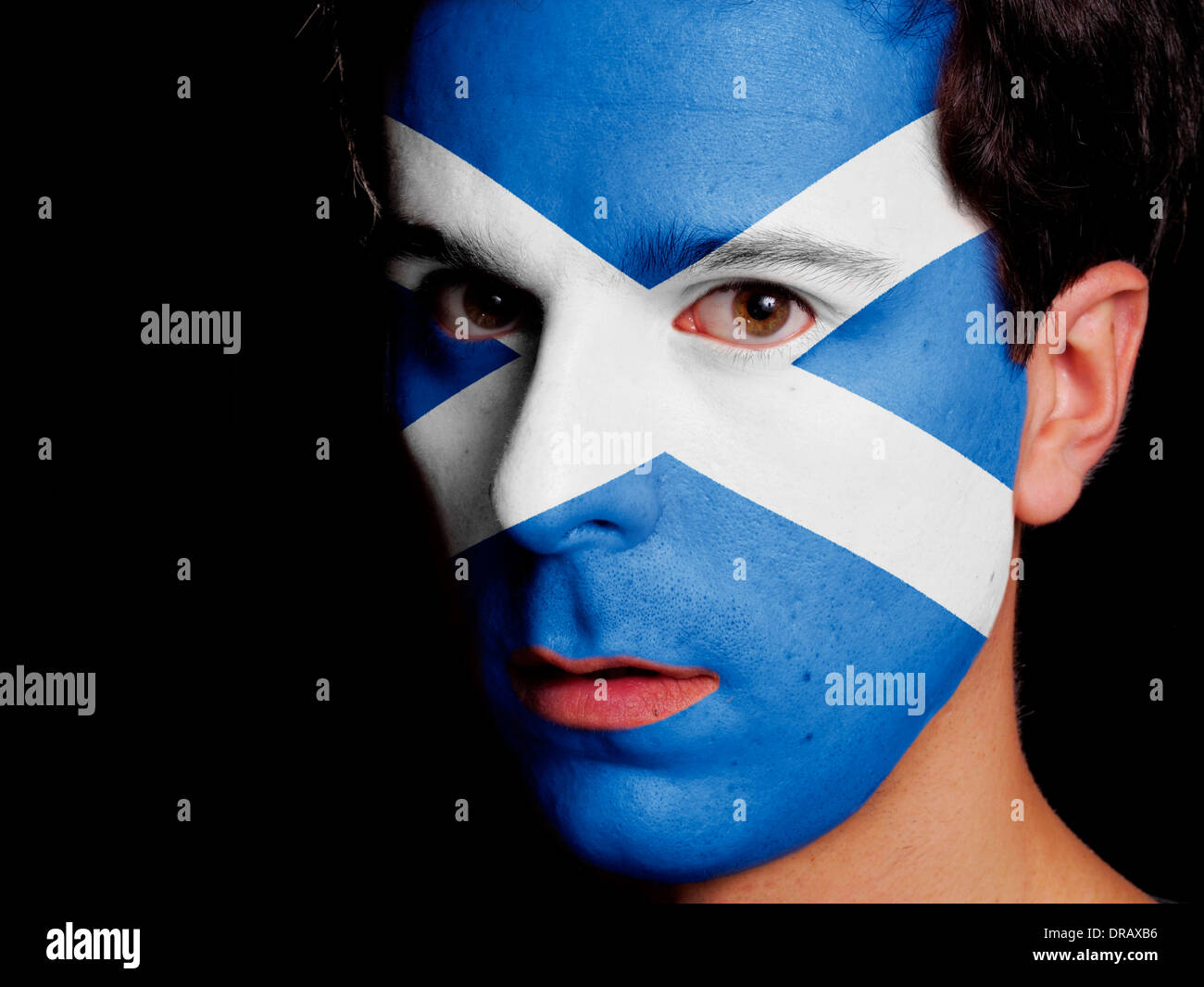 Flag of Scotland Painted on a Face of a Young Man Stock Photo
