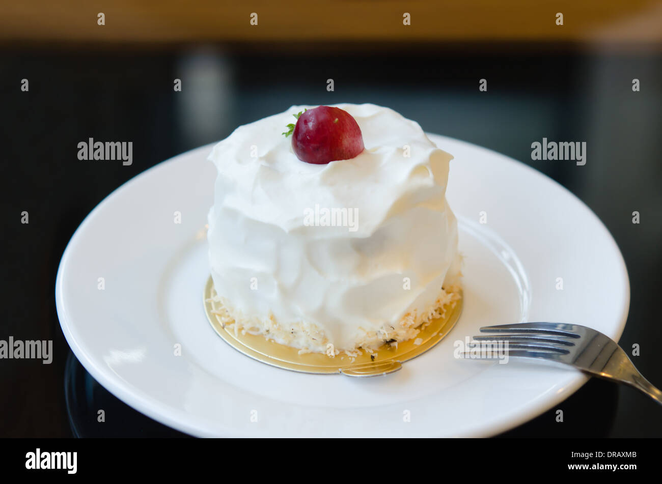 young coconut cake with fresh cream and red grape Stock Photo