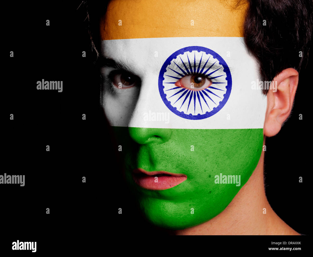 Flag of India Painted on a Face of a Young Man Stock Photo