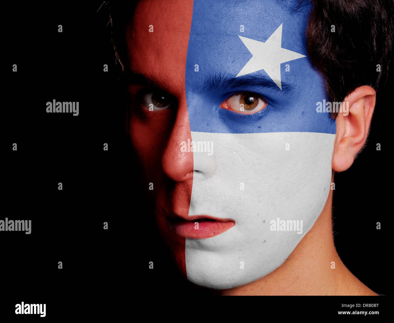 Flag of Chile Painted on a Face of a Young Man Stock Photo