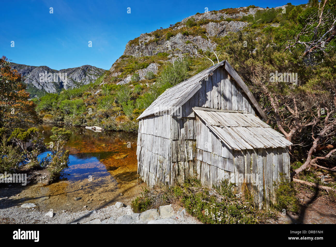 Old wooden hut by lakeside in Cradle Mountain Lake St. Clair National Park Stock Photo