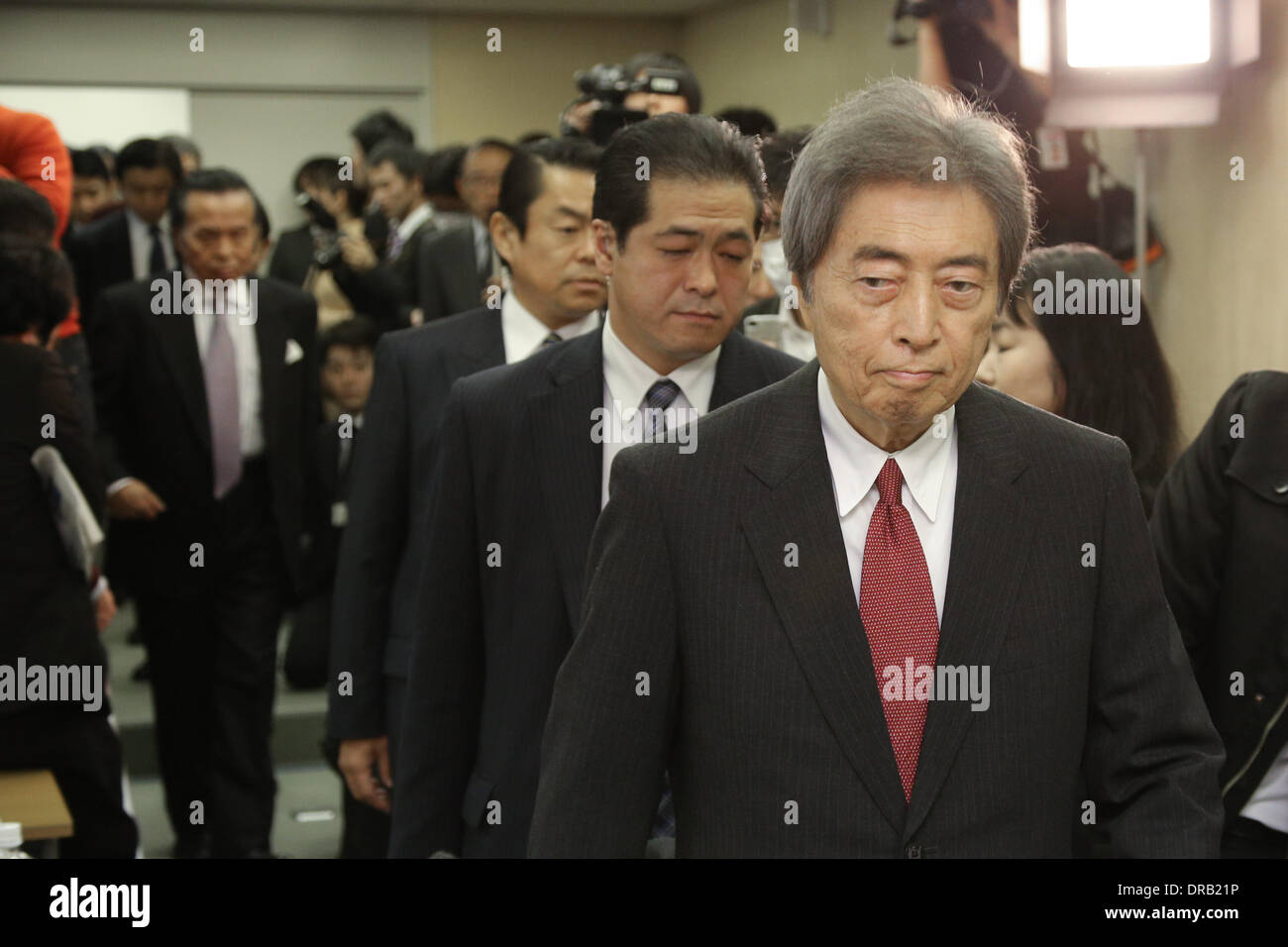 Tokyo, Japan. 22nd Jan, 2014. Japan's former Prime Minister Morihito Hosokawa, right, purses his lips upon arriving for a news conference at the Tokyo City Hall on Wednesday, January 22, 2014, announcing his candidacy in the February 9 gubernatoria election one day before official kick-off of campaigning. Hosokawa, 76, will campaign side by side on the non-nuclear platform with outspoken ex-Premier Junichciro Koizumi, who has championed the immediate elimination of nuclear power plants across the country. Hosokawa is running against a scholar in international politics, a lawyer and a forme Stock Photo