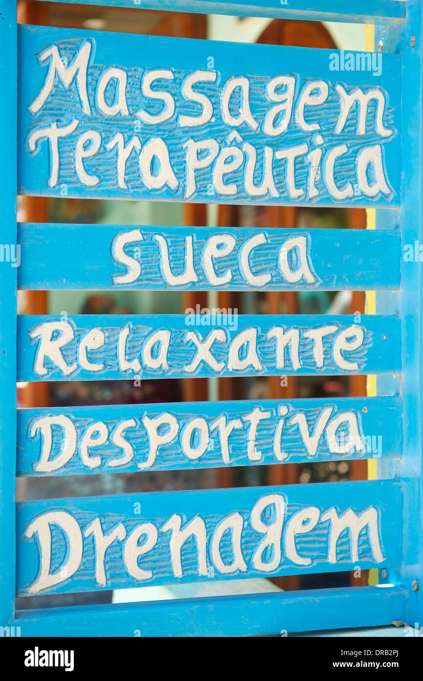 Brazilian massage therapy sign in Portuguese handpainted colorful blue and white Stock Photo