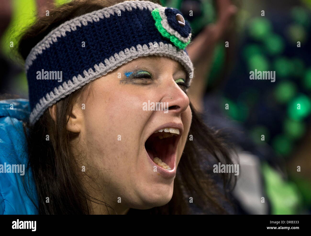 Seattle, WASH, USA. 19th Jan, 2014. Desirae McCaulley of Everett washington cheers on her team during the NFC championship game between the San Francisco 49ers and the Seattle Seahawks at CenturyLink Field in Seattle, Wash. on Sunday, Jan. 19, 2014. © Hector Amezcua/Sacramento Bee/ZUMAPRESS.com/Alamy Live News Stock Photo