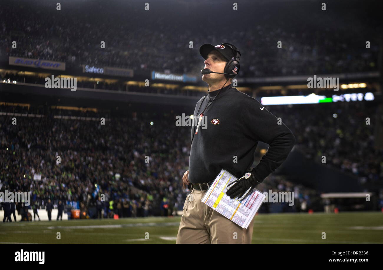 Seattle, WASH, USA. 19th Jan, 2014. San Francisco 49ers head coach Jim Harbaugh looks at the scoreboard as his team loses the lead during the NFC championship game between the San Francisco 49ers and the Seattle Seahawks at CenturyLink Field in Seattle, Wash. on Sunday, Jan. 19, 2014. © Hector Amezcua/Sacramento Bee/ZUMAPRESS.com/Alamy Live News Stock Photo