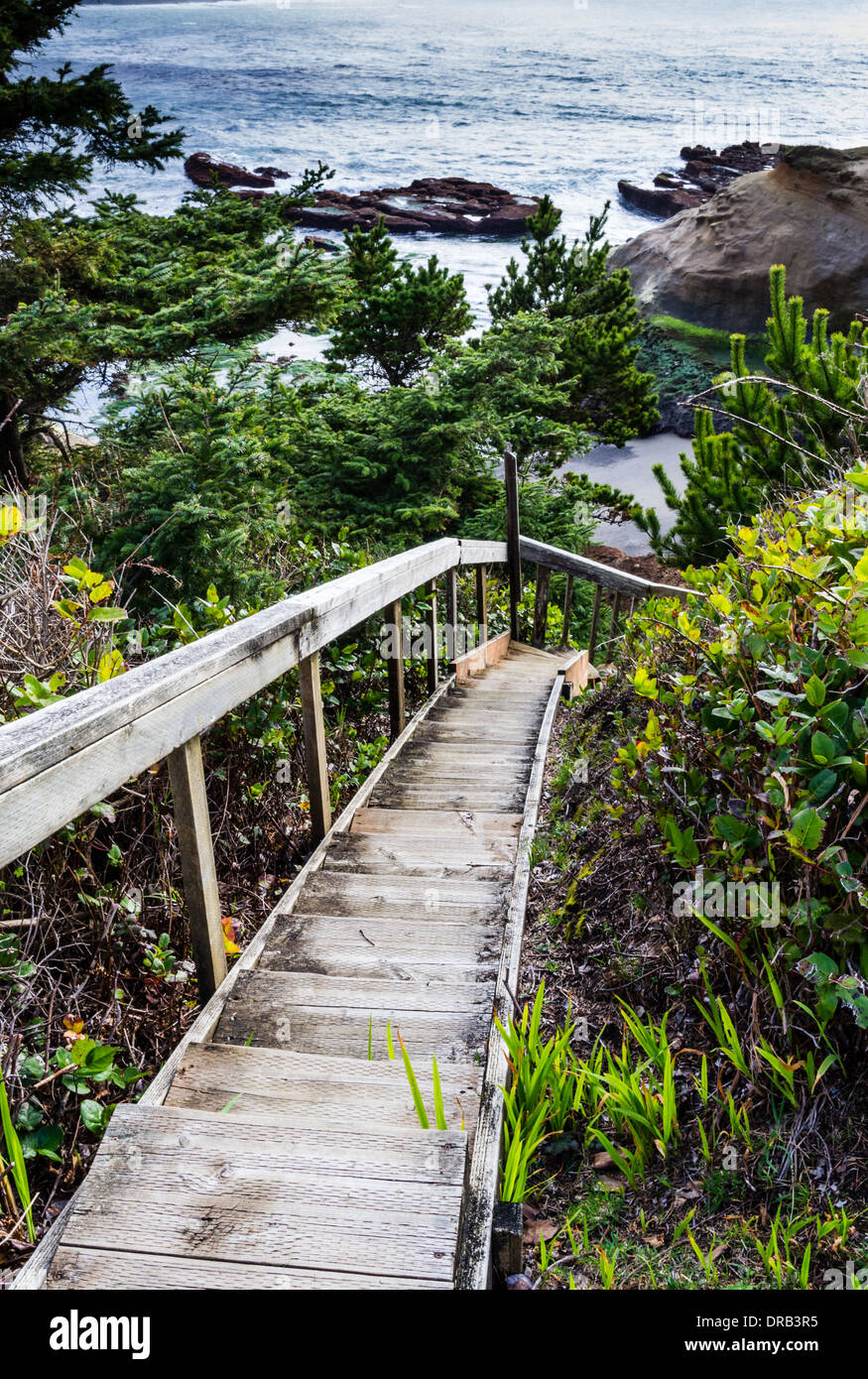 Wooden stairway provides access to the beach at Inn at Arch Rock.  Depoe Bay, Oregon Stock Photo