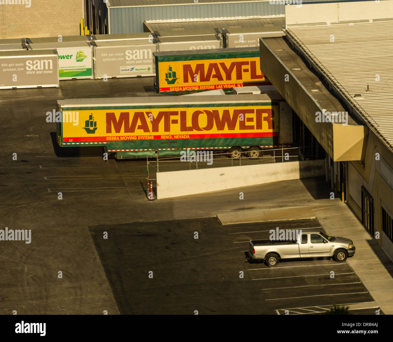 Mayflower moving company trucks at a warehouse loading dock.  Las Vegas Nevada Stock Photo