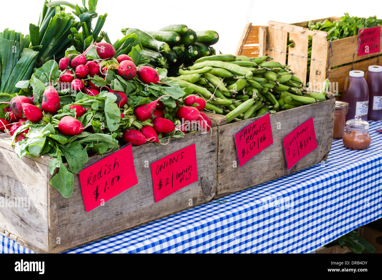 Vegetables including radishes and onions in a farmers market stall.  Gresham, Oregon Stock Photo