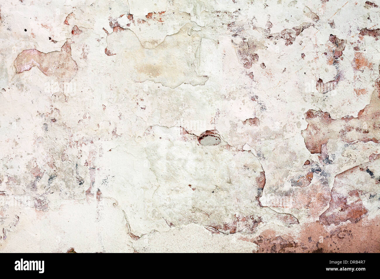 Old grunge wall with cracked stucco. Background texture Stock Photo