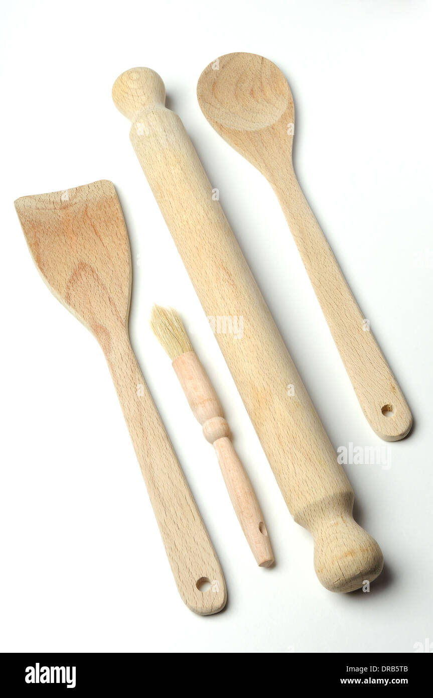Wooden kitchen utensils isolated on neutral background Stock Photo