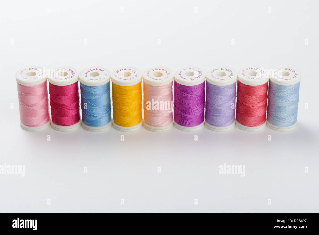Coloured threads by Drima on neutral background Stock Photo