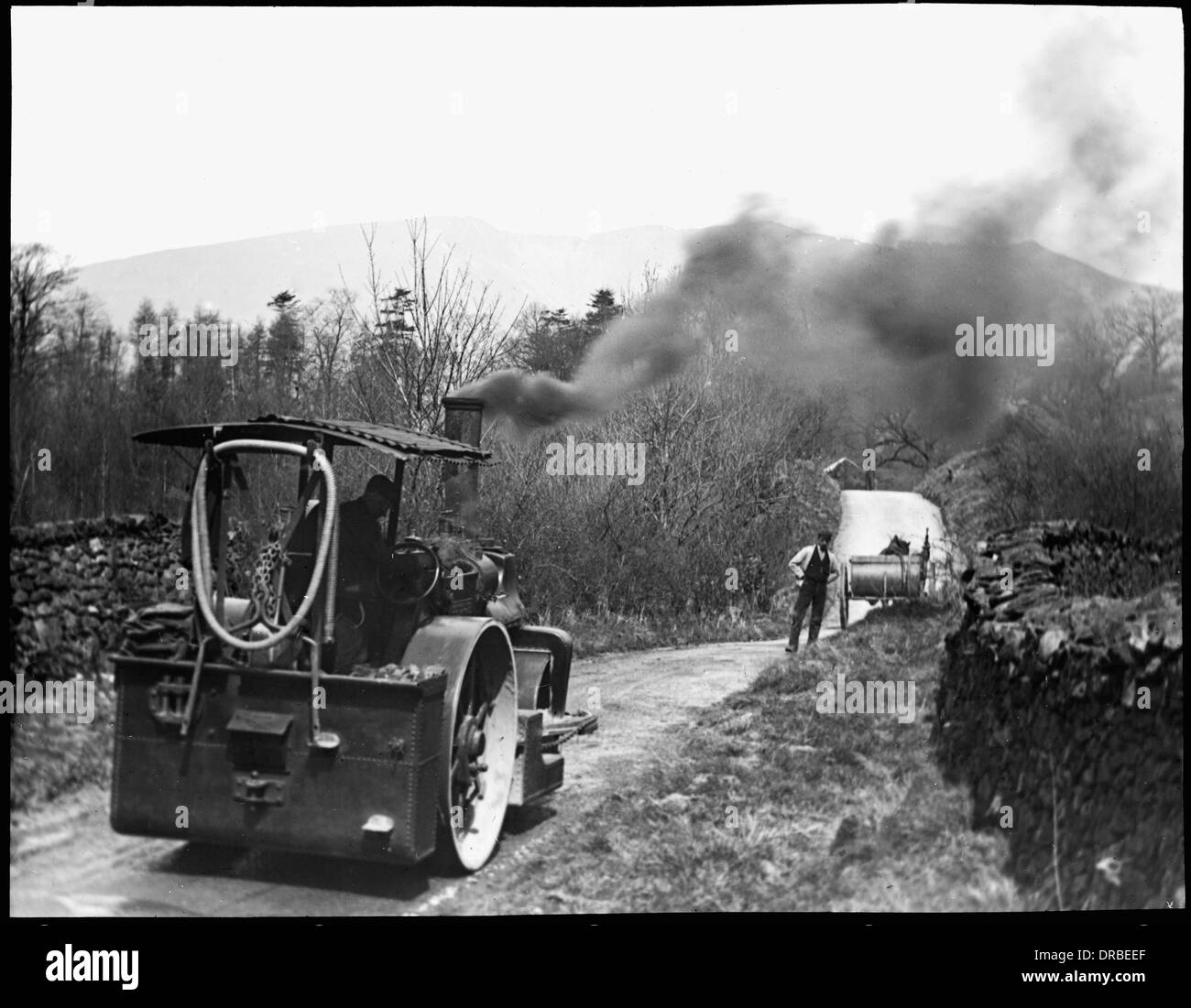Steam road-roller working. Glass lantern slide labelled 'Road mending in the Lake District'. Photograph taken around 1906. Stock Photo