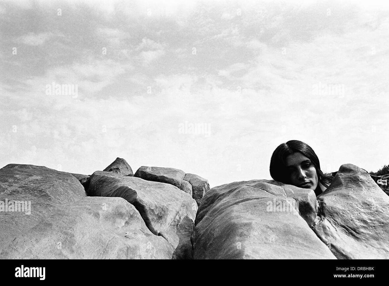 Woman face and rocks, Bhayandar, Mumbai, Maharashtra, India, 1973 Stock Photo