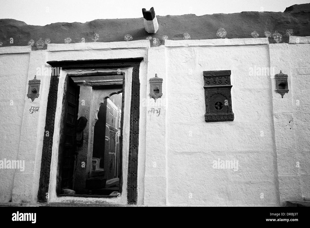 Door and exterior stone wall alcoves of house, Jaisalmer, Rajasthan, India, 1984 Stock Photo