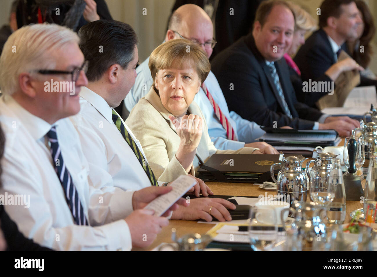 Federal Foreign Minister Frank-Walter Steinmeier (SPD, L-R), Federal Economy Minister Sigmar Gabriel (SPD), Federal Chancellor Angela Merkel (CDU), head of the Federal Chancellery Peter Altmeier (CDU), state secretary Helge Braun, minister of state for culture and media Monika Gruetters (CDU), publicist Steffen Seibert and the minister of state for integration Aydan Ozoguz (SPD) participate at the conference of the cabinet in Meseberg, Germany, 23 January 2014. The German federal cabinet meets to discuss the further policy. Photo: Maurizio Gambarini/dpa Stock Photo