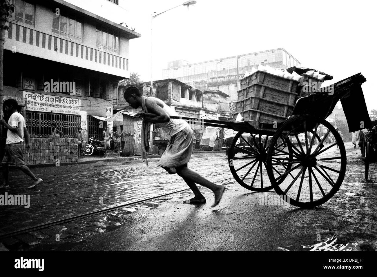 Rickshaw puller struggling, Calcutta Kolkata, West Bengal, India, 1989 Stock Photo