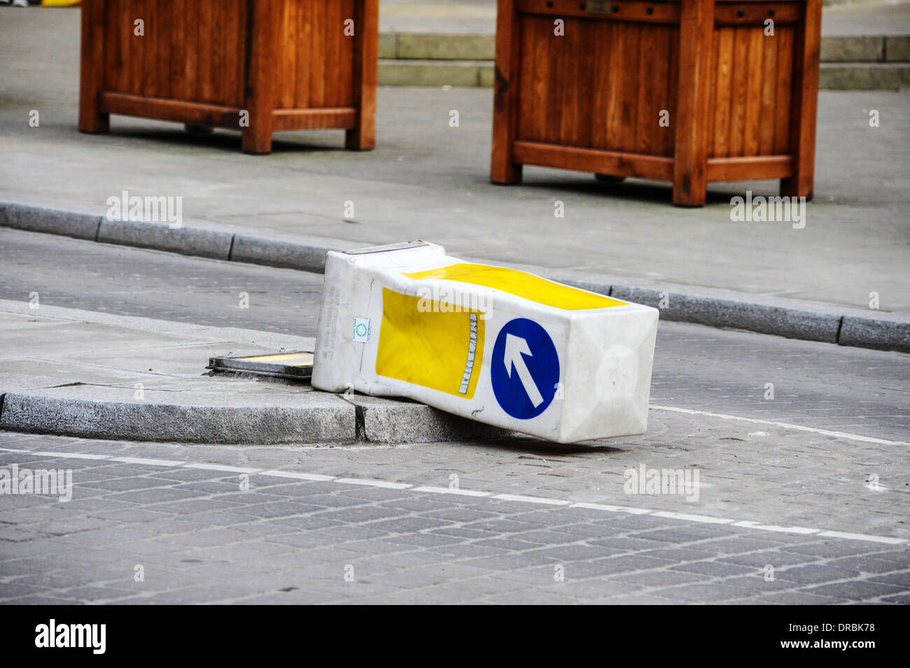 A knocked down road bollard, UK. Stock Photo