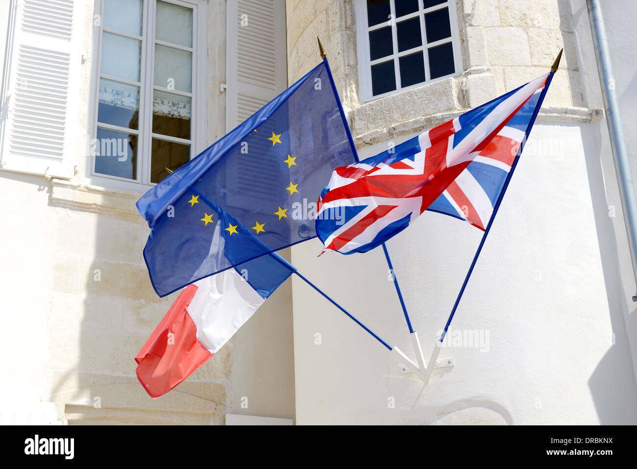 three flags fly together unity of france and england throught the european union Stock Photo
