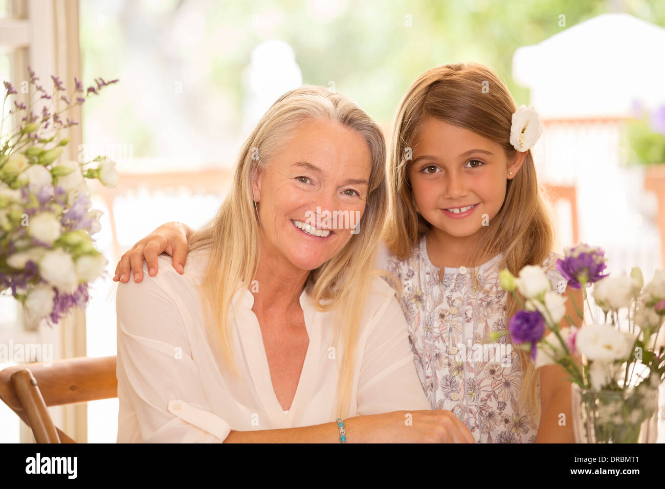 Grandmother and granddaughter smiling Stock Photo
