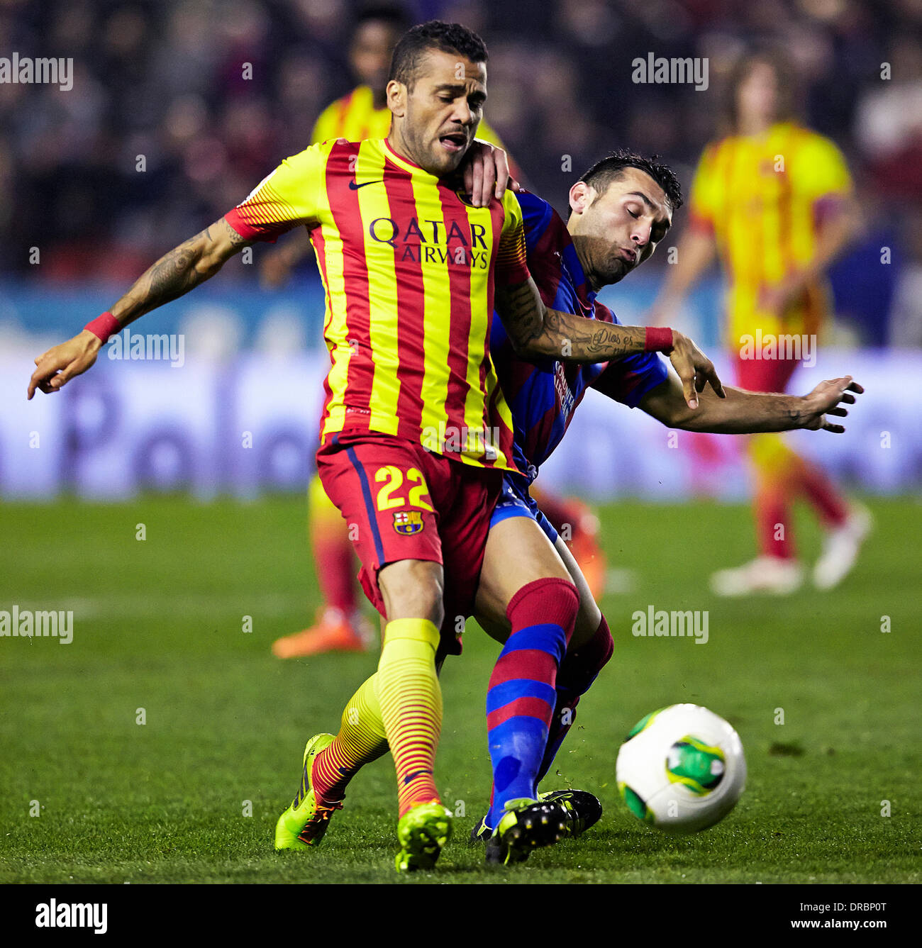 Valencia, Spain. 22nd Jan, 2014. Defender Dani Alves of FC Barcelona (R) takes on Forward Barral of Levante U.D. during the Copa del Rey game between Levante and Barcelona at the Ciutat de Valencia, Valencia Credit:  Action Plus Sports/Alamy Live News Stock Photo