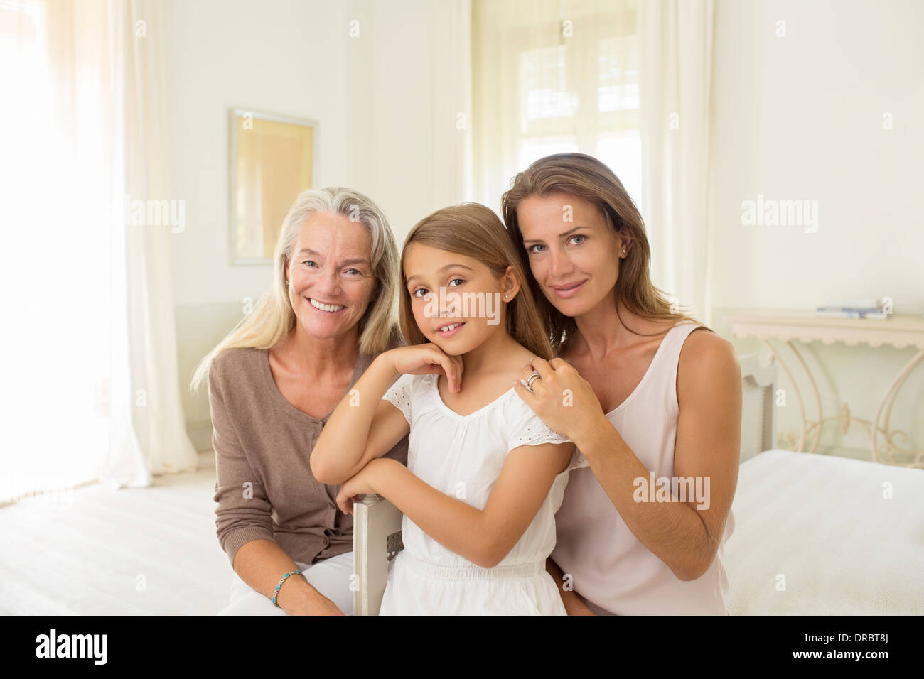 Multi-generation women in bedroom Stock Photo
