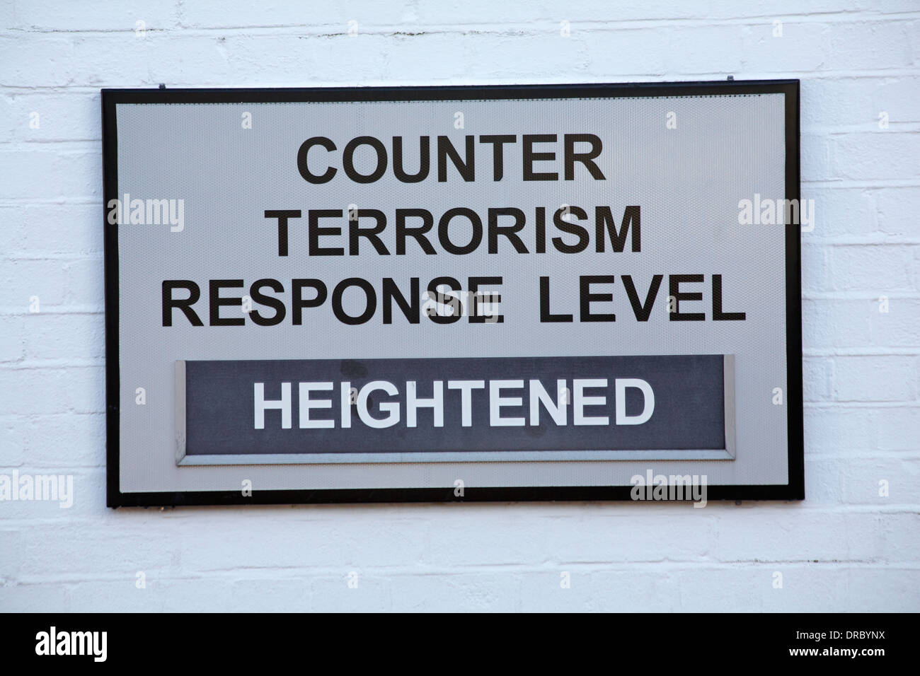 counter terrorism response level heightened sign on building wall at Portsmouth Historic Dockyard in January Stock Photo