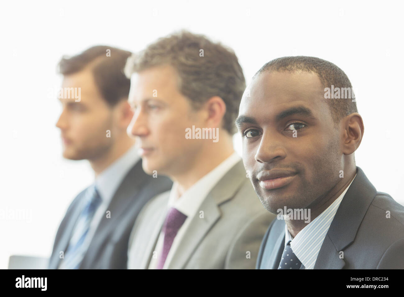 Businessmen sitting in office Stock Photo