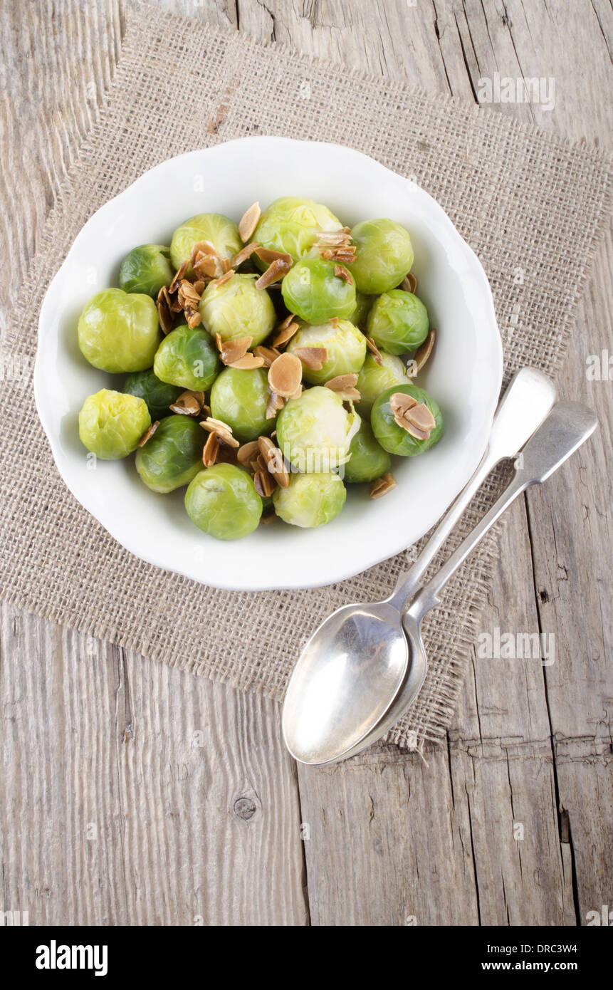 brussel sprouts with roasted almonds in a white bowl Stock Photo