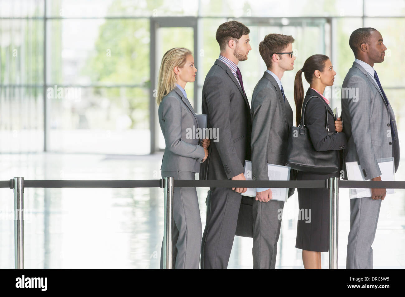 Business people waiting in line Stock Photo